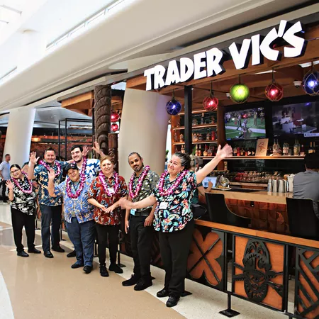 Trader Vic's employees pose and celebrate the first anniversary of Trader Vic's at SJC.